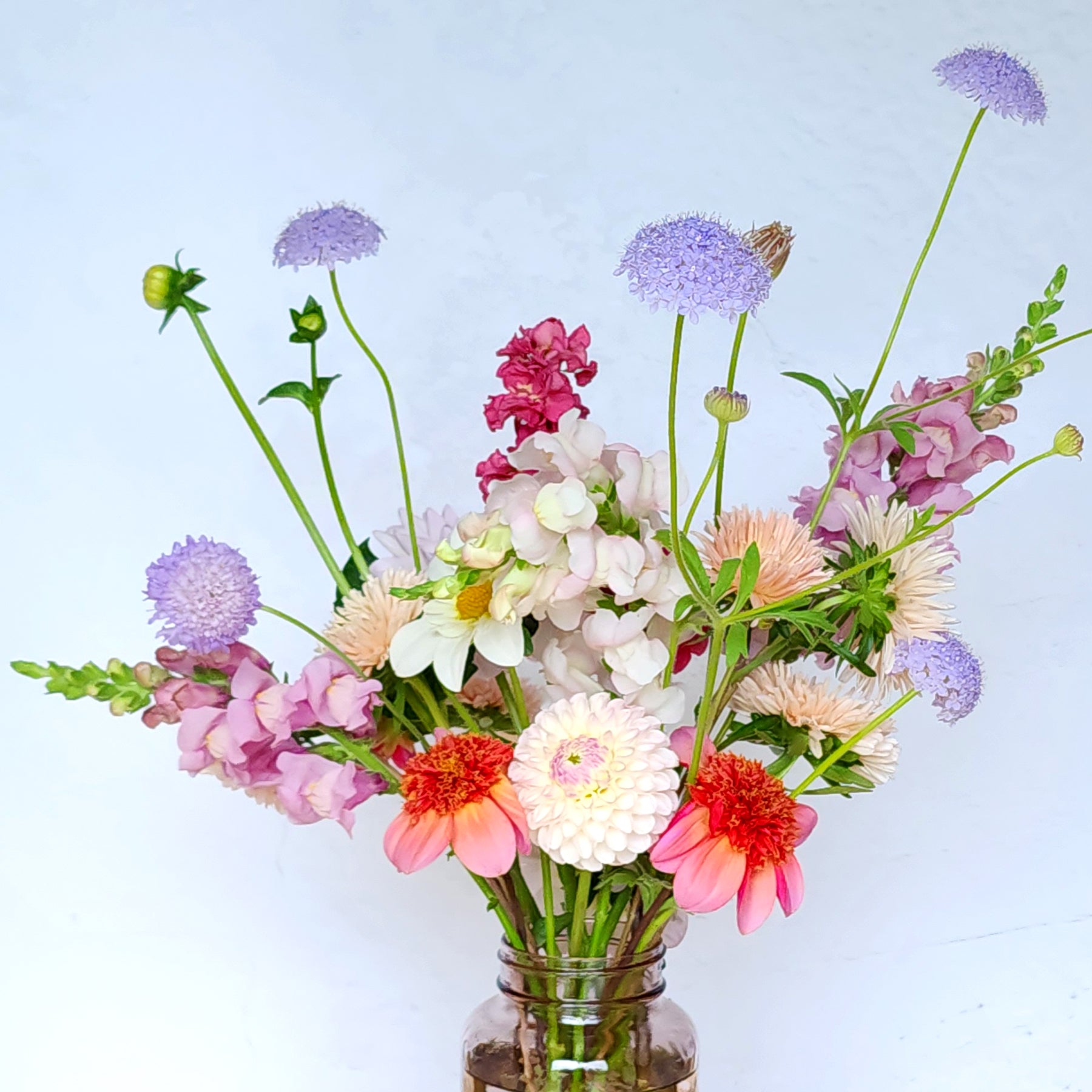 totally tangerine dahlia in bouquet